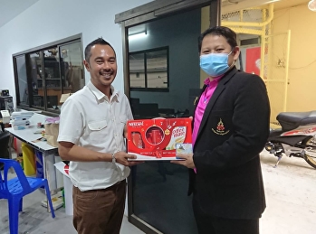 Giving a New Year gift to the Building
and Service Department